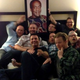 Former World of Warcraft developer Alex Afrasiabi and other Blizzard developers posing with a portrait of Bill Cosby at BlizzCon 2013.